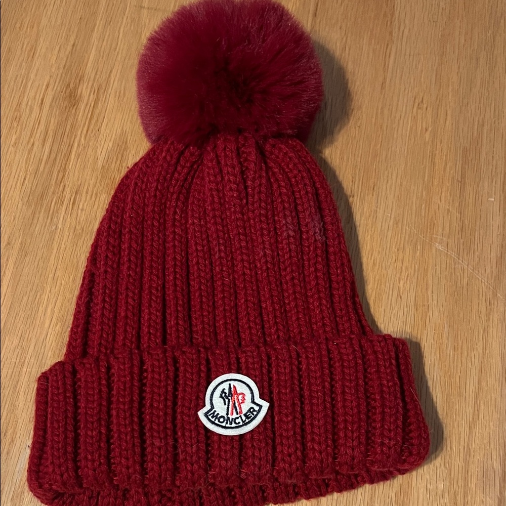 Red knit designer beanie with ball